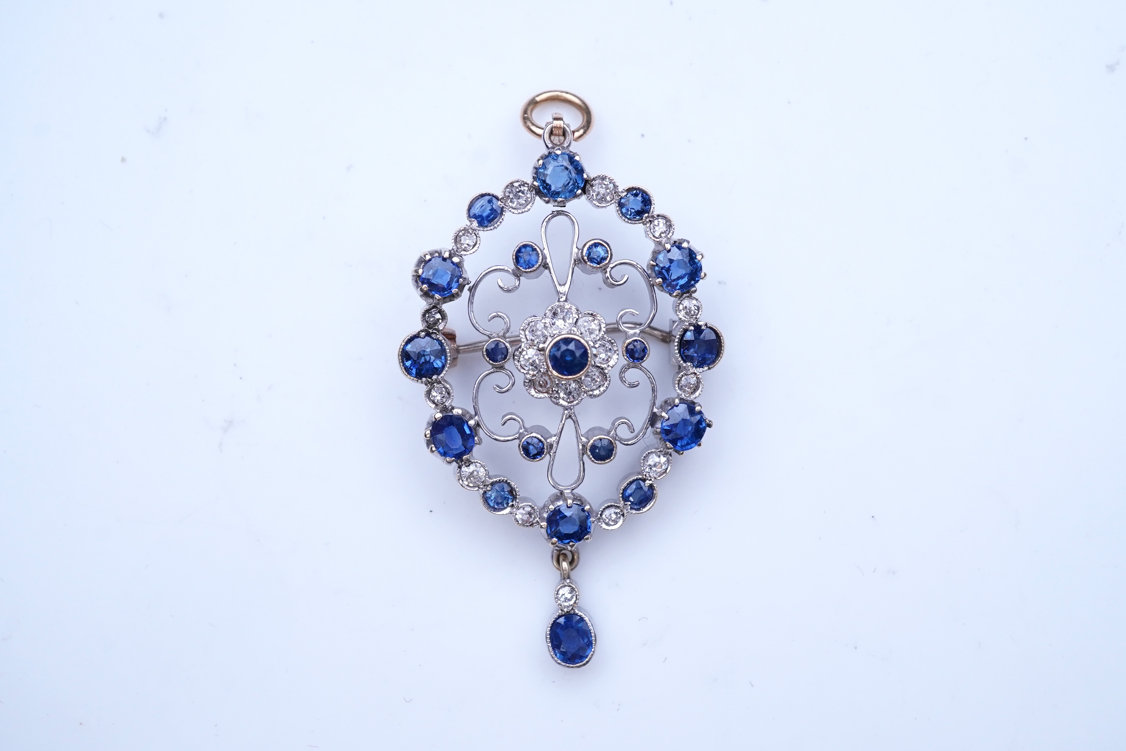 A sapphire and diamond brooch/pendant, mid 20th century